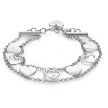 Carica l'immagine nel visualizzatore di Gallery, Bracciale da donna a doppio filo con sette cuori ripetuti in successione, in acciaio lucido e cristalli incolore