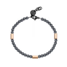 Carica l'immagine nel visualizzatore di Gallery, bracciale con perline di ematite intermezzate da elementi esagonali in acciaio lucido di colore oro rosa e terminali placcati neri

