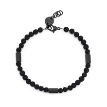 Carica l'immagine nel visualizzatore di Gallery, bracciale con perline di pietra lavica intermezzate da elementi esagonali in acciaio lucido e terminali placcati neri
